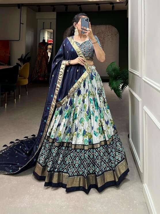 Women's bandhani print chaniya choli showcases intricate ajrakh print Foil Work Patola Print Semi-stitched Lehenga choli
